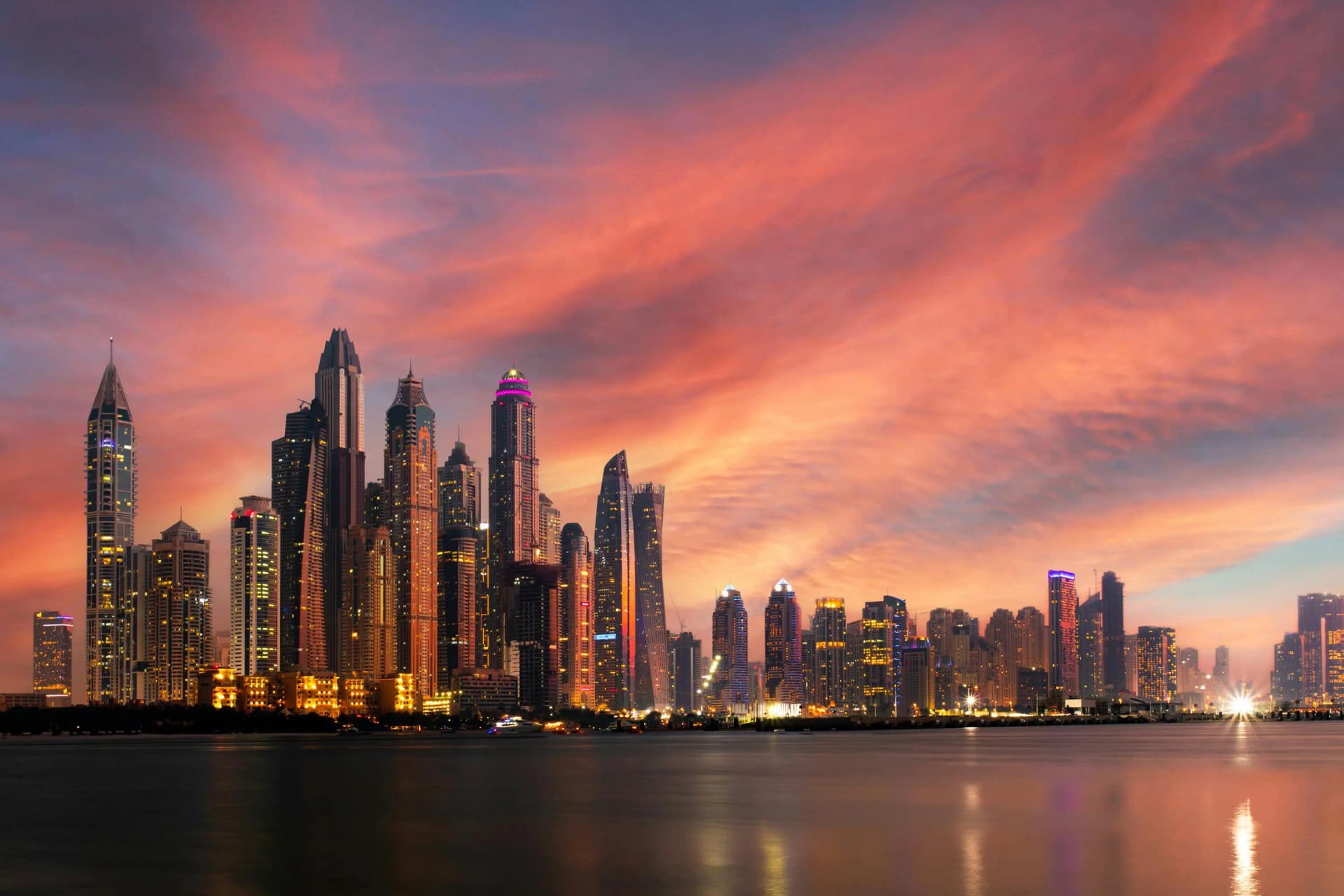 Tax consultants in Dubai - Apex FinConsultants office with Dubai Marina skyline
